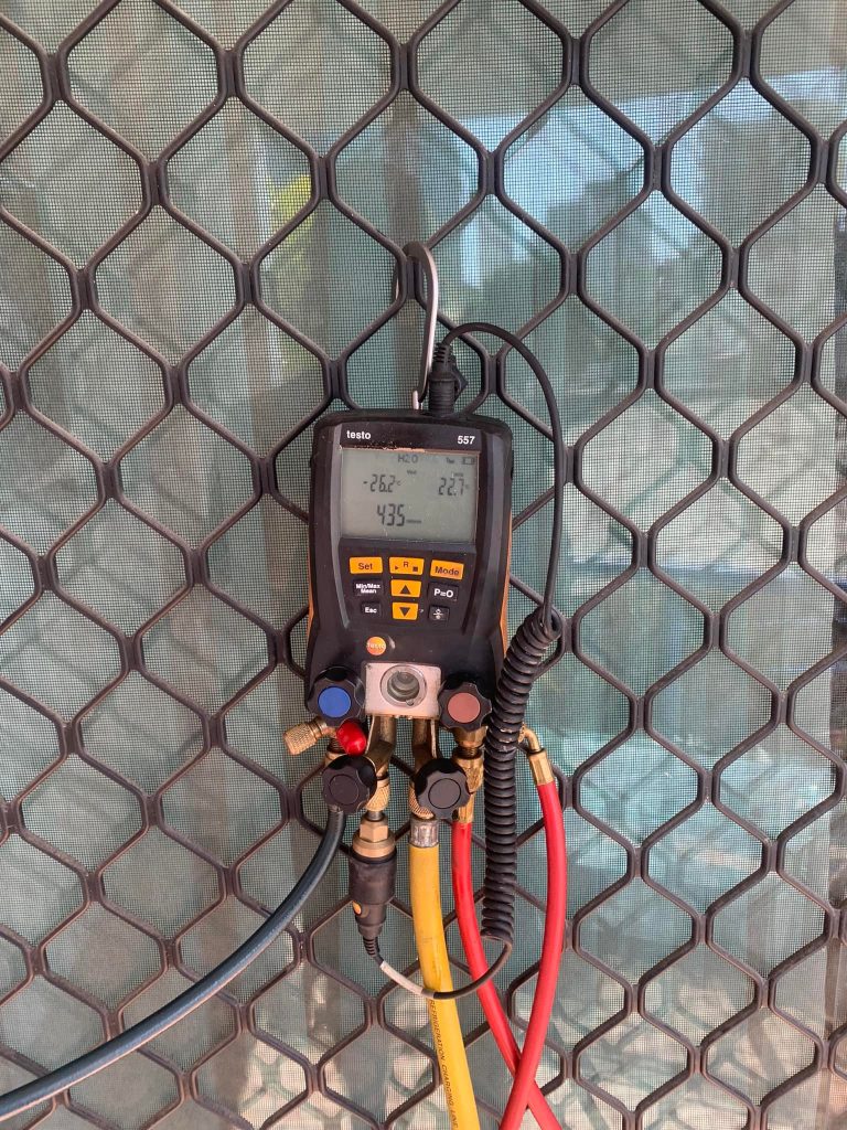 Air-conditioning repair work by a Shoreline technician